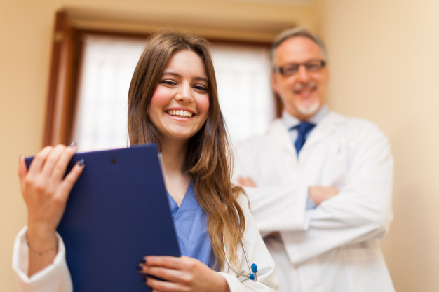 Front Desk Agent taking patients notes