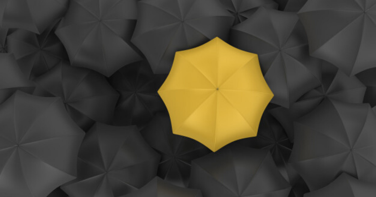 many-black-umbrellas-with-one-yellow